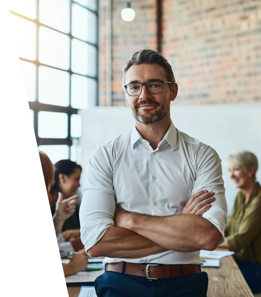 Professional WordPress development expert standing confidently in a modern office, representing website strategy, custom development, and digital solutions.